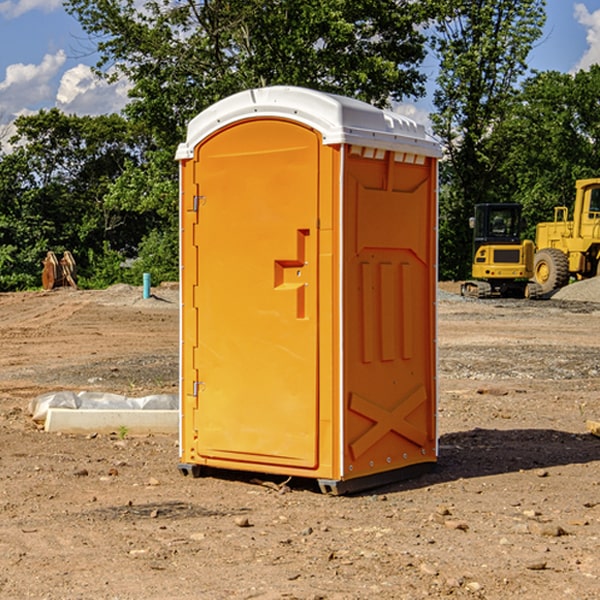 what is the cost difference between standard and deluxe porta potty rentals in Kinsman Center